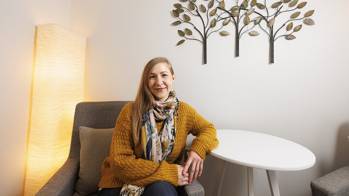 Kathryn Holland sitting in a room